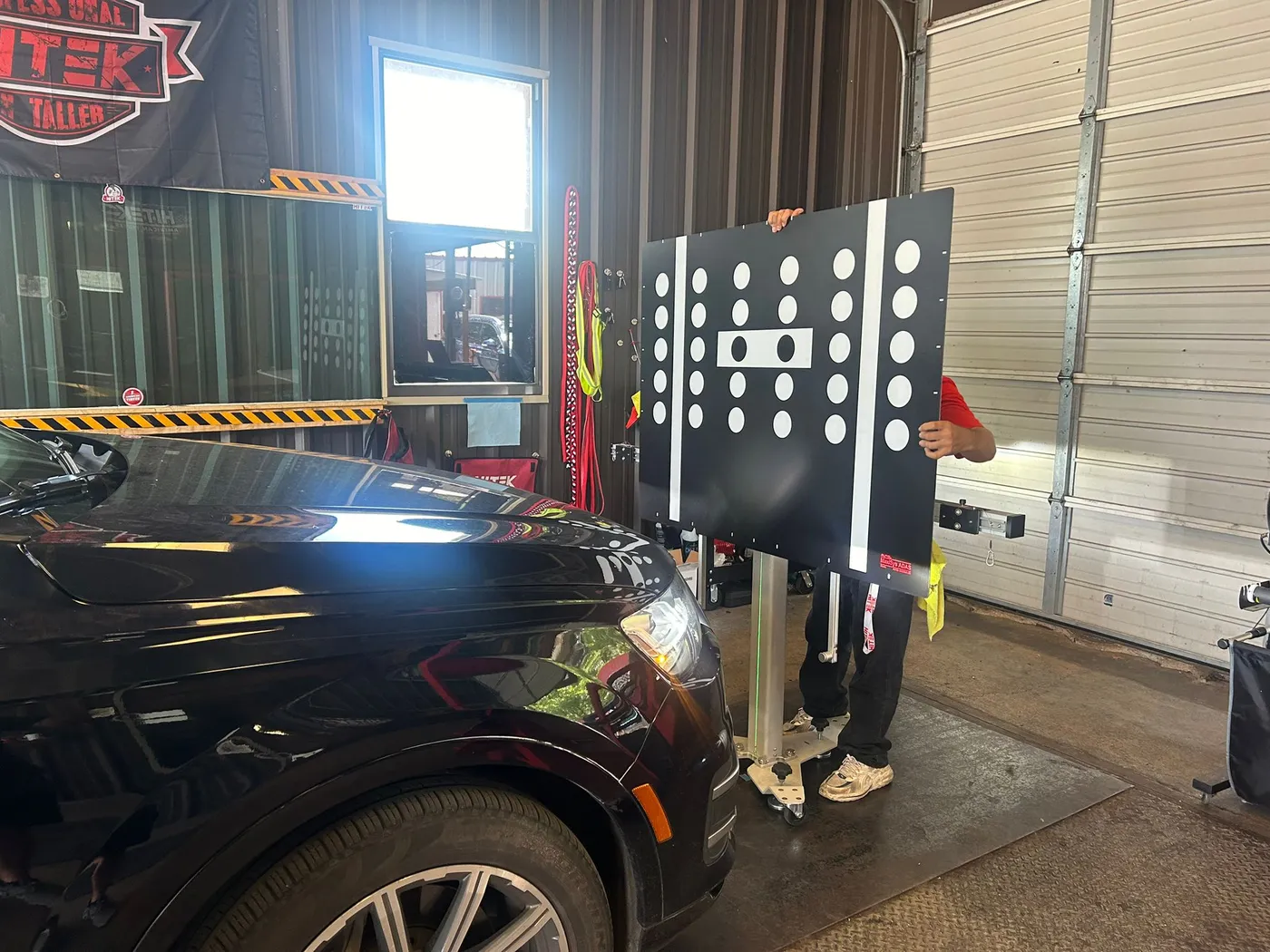 In-progress ADAS camera calibration with the alignment target board at the AGC shop